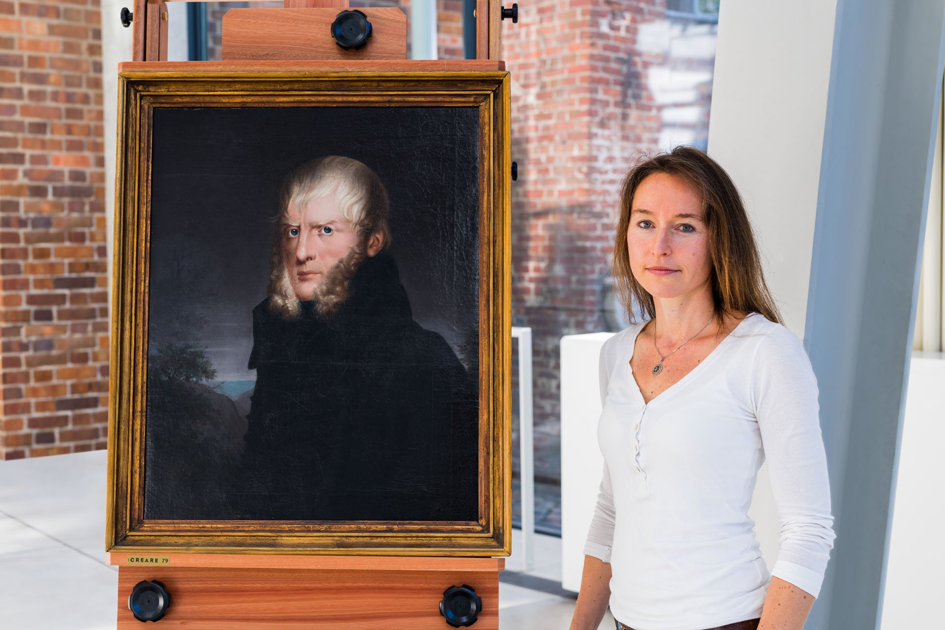 Archaeologist Katrin Staude in the Pomeranian State Museum next to the &quot;Portrait of the Painter Caspar David Friedrich&quot;.